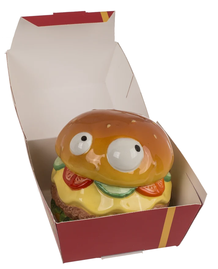 Hucha de cerámica en forma de hamburguesa dentro de caja de regalo abierta