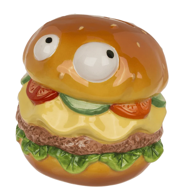 Hucha hamburguesa con cara divertida, capas de queso, lechuga y tomate