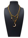 Collar doble de mujer en acero dorado con colgante de media luna, estrella y detalles brillantes