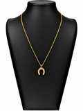 Collar Aurora dorado con colgante de herradura de la suerte y brillantes