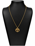 Collar Elara de acero dorado con árbol de la vida y borde circular decorado con brillantes