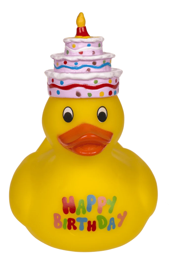 Patito amarillo de cumpleaños con sombrero de tarta, vista lateral