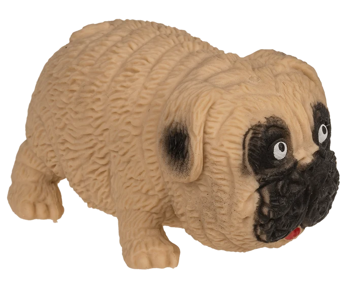 Perro squishy estrujable sostenido en una mano