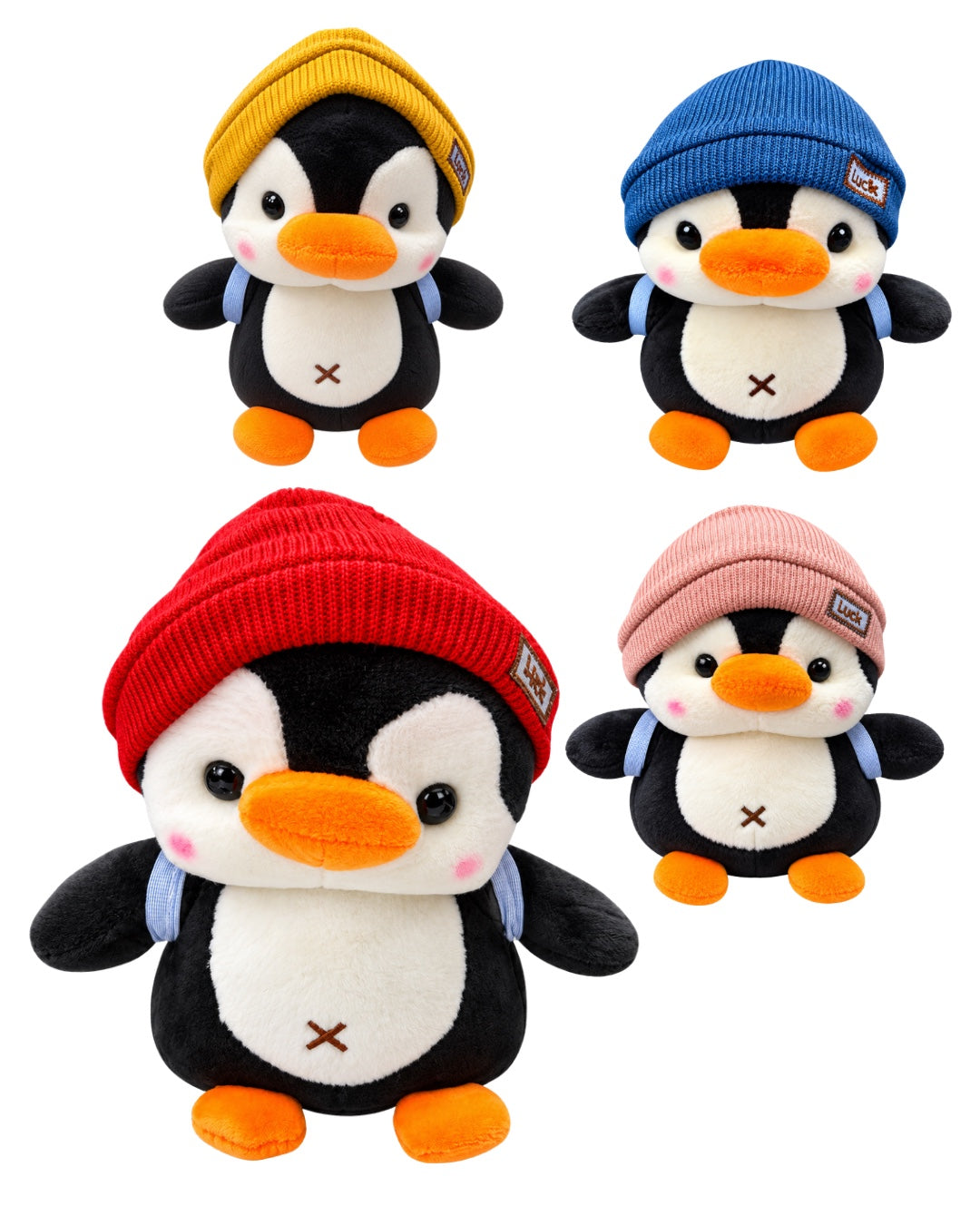 Pingüinos de peluche con gorros rojo, azul, ocre y rosa