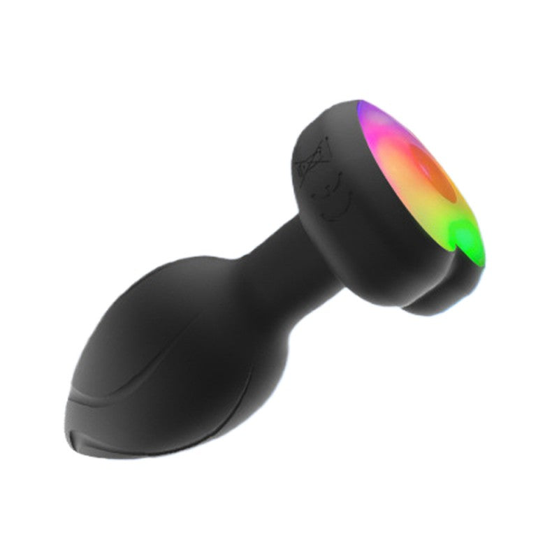 Plug Vibrador con Luz de Silicona Negra Control Remoto Recargable 10 modos