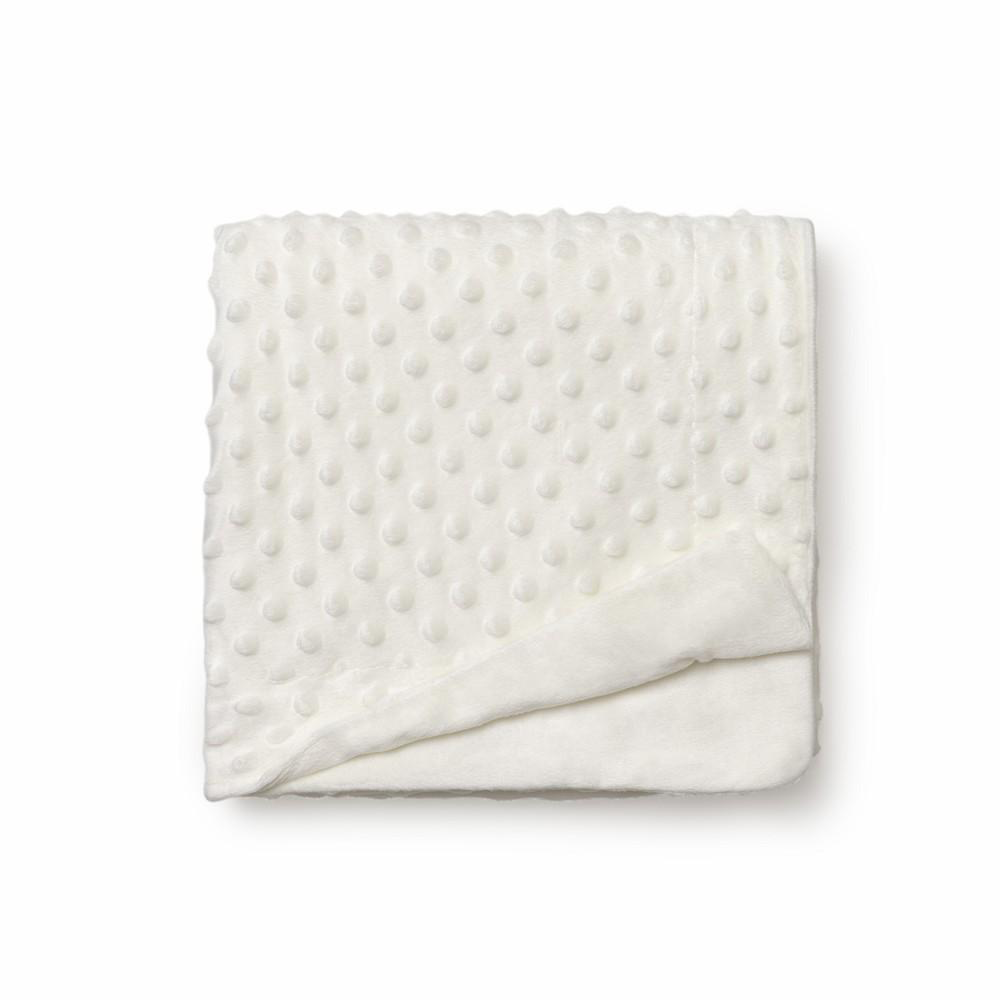 Manta beige crema para bebé con topitos en relieve, detalle del tejido